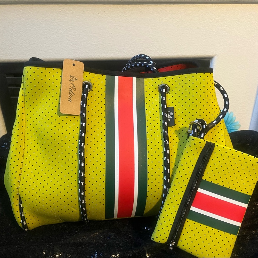 Scuba fabric yellow with black and white trim has a wallet with it